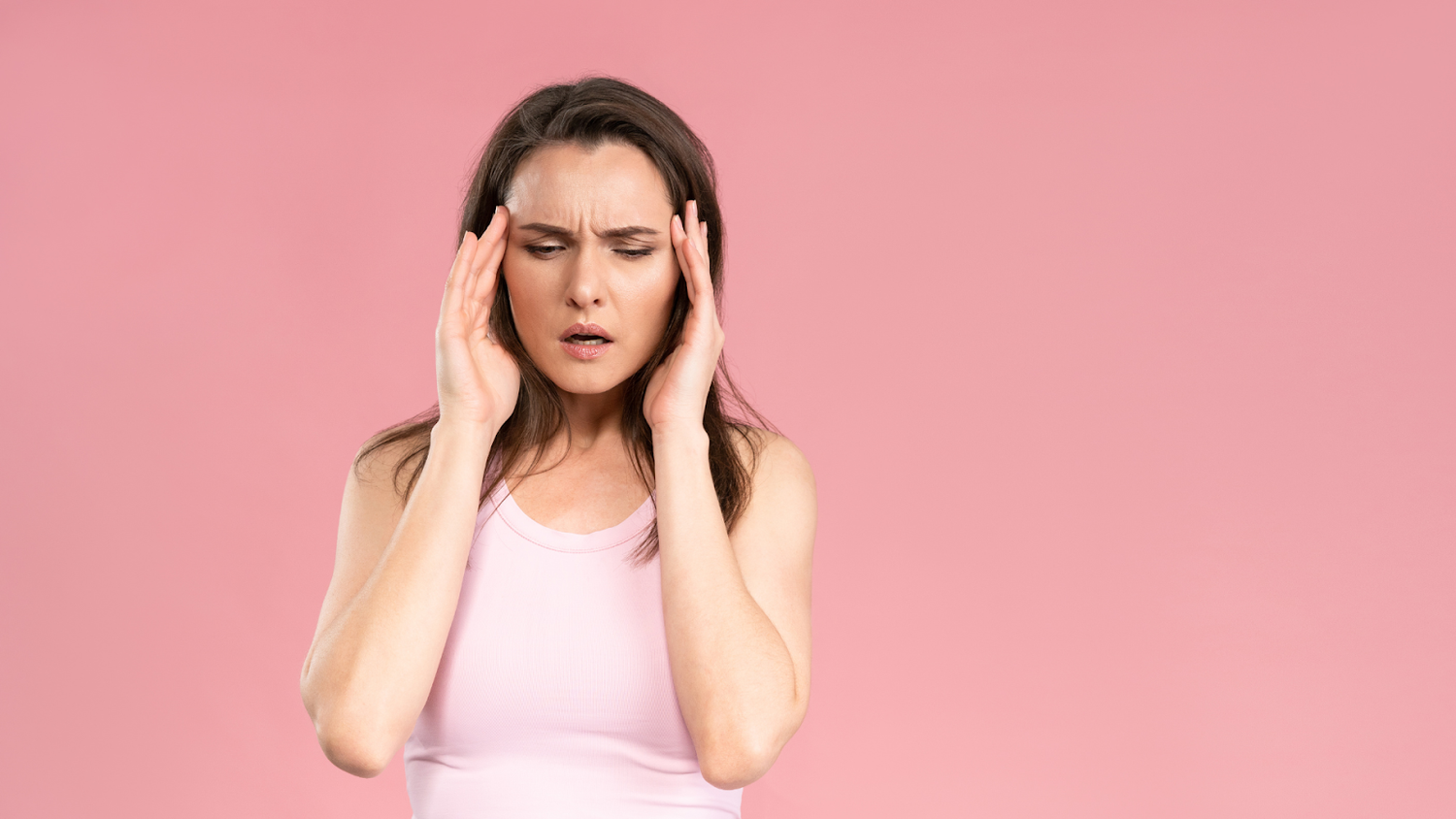 Woman experiencing migraine